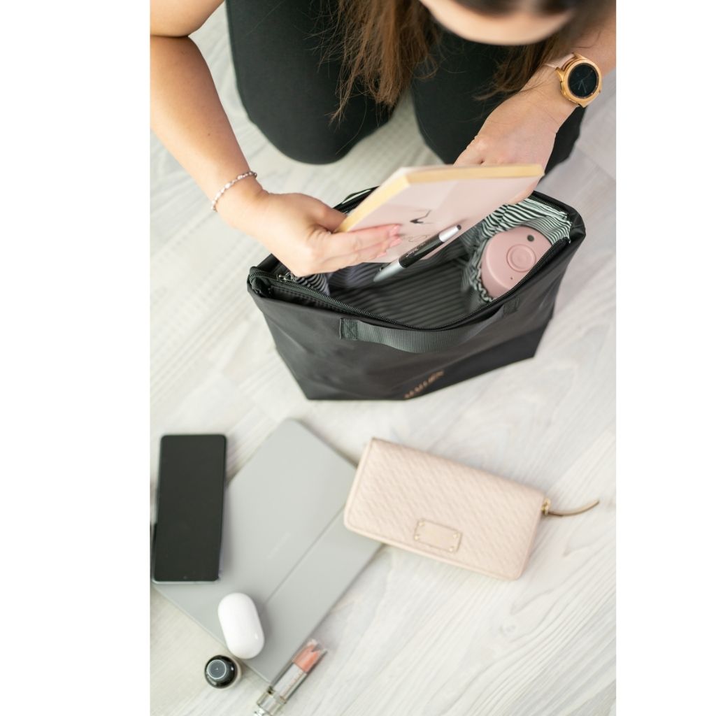 The bag insert is used to go into a handbag or tote bag to keep items organised/organized.